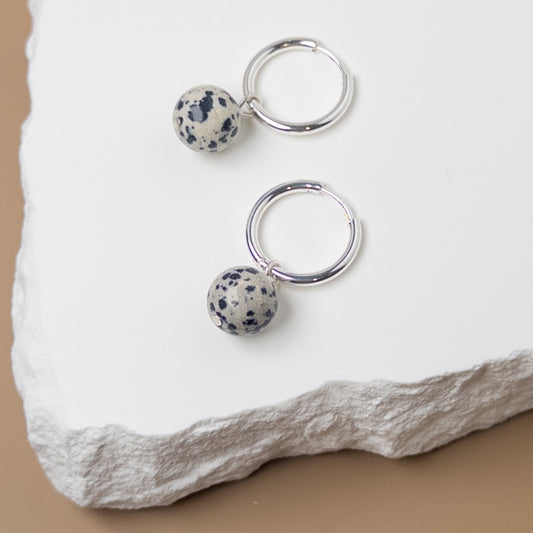 Silver huggie with dalmation jasper bead