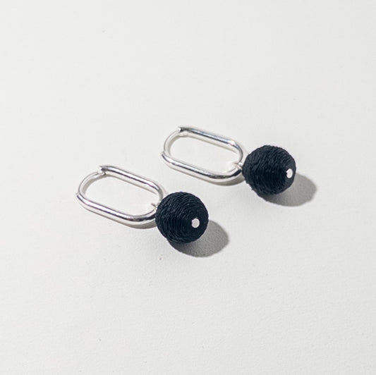 Silver Oval Huggie Earrings with Removable Matte Black Bead Charm